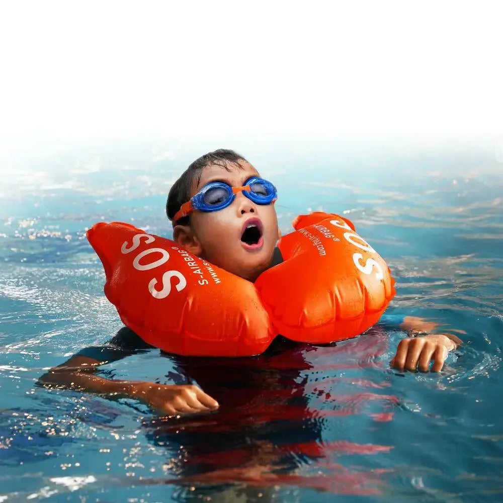 Child floating safely with Flotis airbag life jacket in water